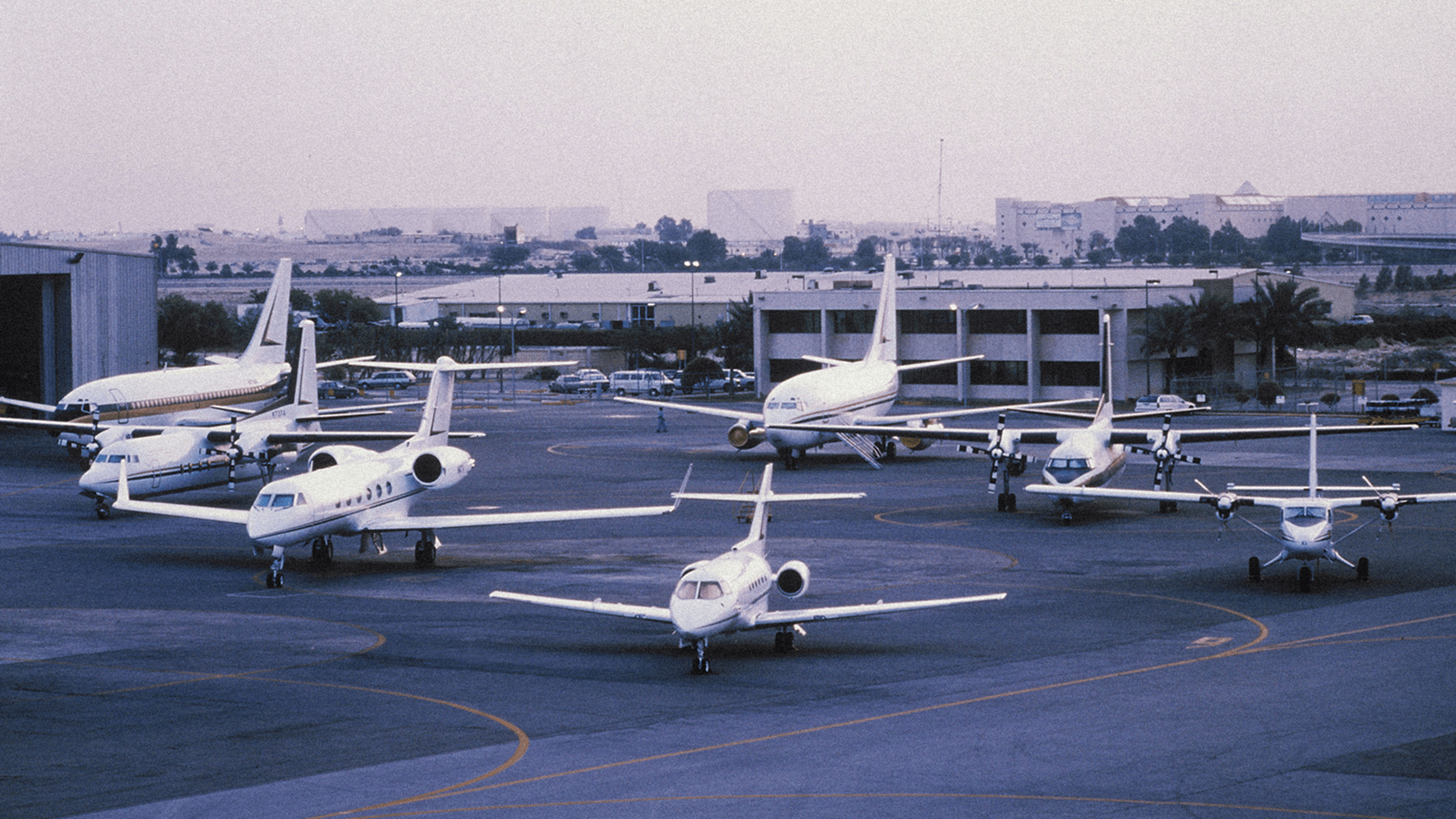 Several Mukamalah airplanes portrayed at the Saudi Arabian airport airstrip