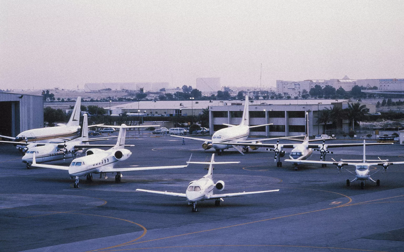 Several Mukamalah airplanes portrayed at the Saudi Arabian airport airstrip