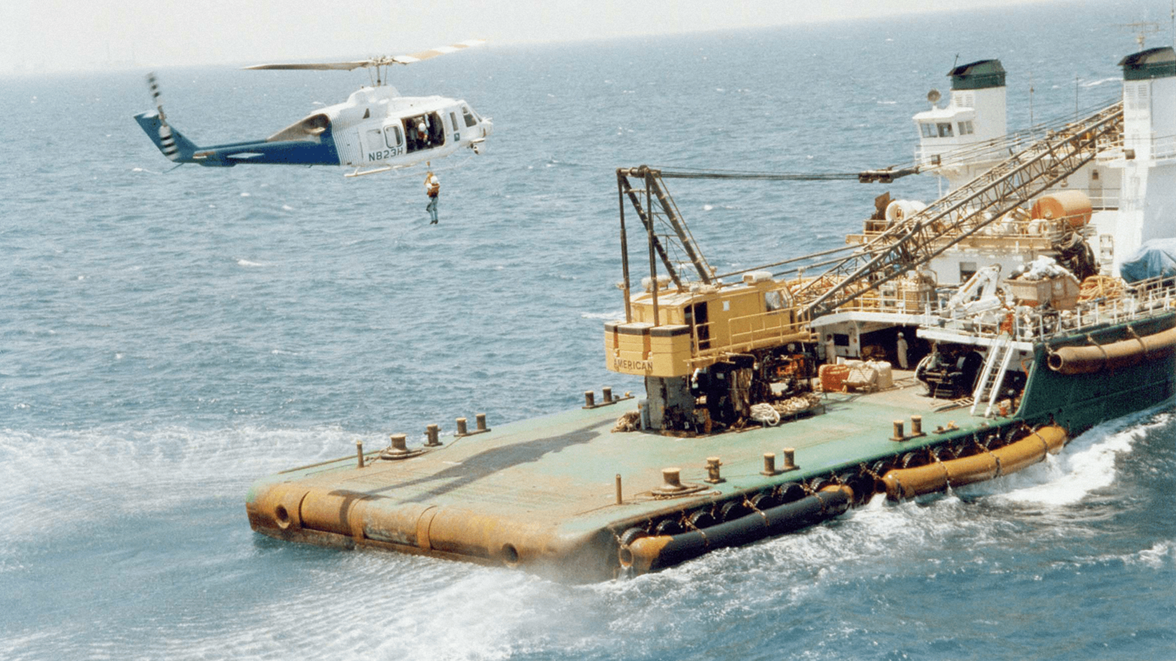 Mukamalah helocopter performing a maritime landing on a ship dock